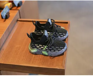 Detailed view of breathable black toddler sneakers with soft translucent soles