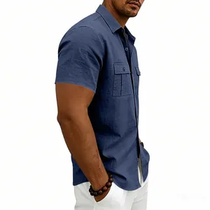 Macro view of navy blue short-sleeved linen casual shirt featuring chest pockets