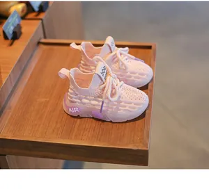 Close-up detail of breathable pink mesh sport shoes for toddlers and infants.