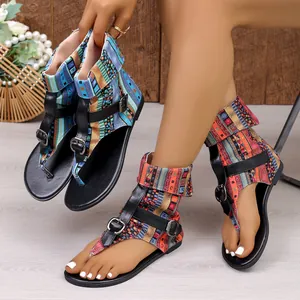 Detailed macro view of bohemian printed ankle strap sandals featuring buckle hardware straps