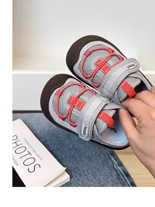 Close-up view of breathable mesh kids sneakers featuring adjustable strap and soft sole
