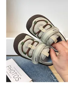 Close-up of breathable mesh children's sneakers with soft soles and velcro straps