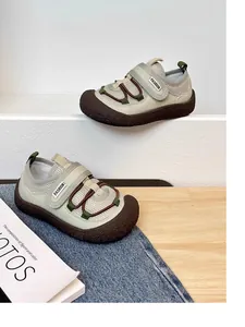 Detailed side view of children's breathable mesh sneakers with soft soles and velcro straps