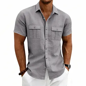 Detail view of men's grey linen short sleeve cargo shirt with functional chest pockets