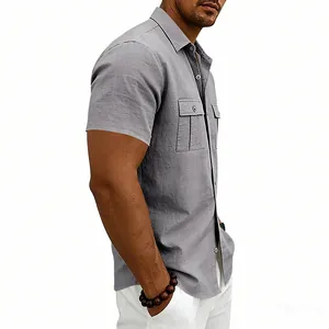 Side view of a grey short-sleeved linen utility shirt for men with chest pockets.