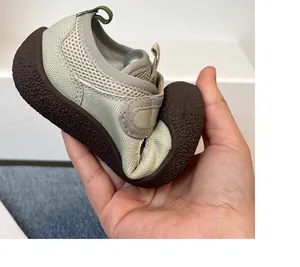 Flexible soft sole of breathable mesh toddler sneakers showing great elasticity.