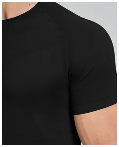 Close-up detail of black seamless men's athletic shirt showing breathable mesh texture
