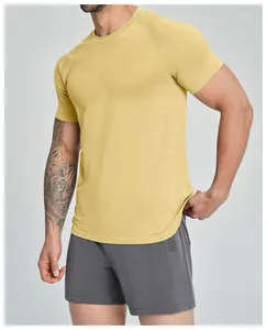 Detailed view of yellow seamless men's athletic shirt featuring quick-dry textured fabric