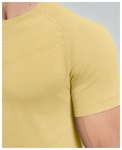 Detail of men's seamless quick-dry sports t-shirt with mesh texture in yellow