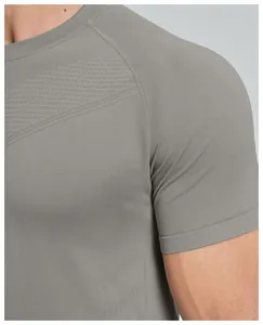 Close-up of grey seamless athletic t-shirt showing breathable texture and stitching