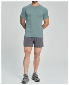 Men's seamless quick-dry athletic fitness t-shirt in teal blue worn by a model