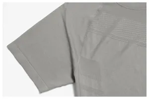 Detailed view of grey seamless quick-dry sports shirt showing sleeve fabric texture