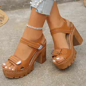 Detailed close-up view of stylish brown chunky heel platform sandals with velcro straps being worn
