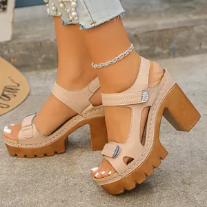 Detailed side view of stylish beige platform sandals with chunky heels and Velcro straps