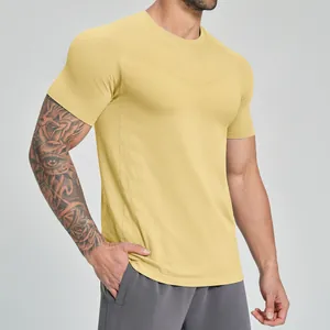 Athletic men's yellow seamless quick-dry sports t-shirt for fitness and outdoor hiking
