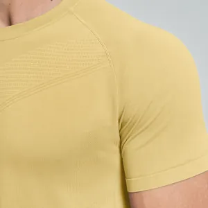 Close-up of men's yellow seamless quick-dry sports t-shirt with breathable texture