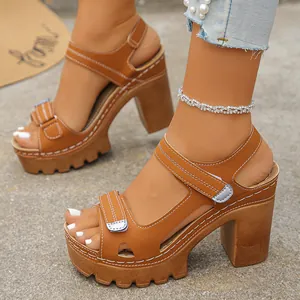 Detailed side view of brown platform sandals with velcro straps and high block heels