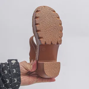 Detail of thick anti-slip sole on brown chunky heel platform sandal showing size 37