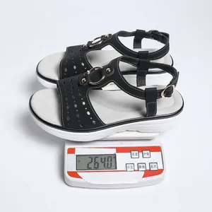 Lightweight detail showing a black wedge sandal weighing 264.0g on a digital scale.