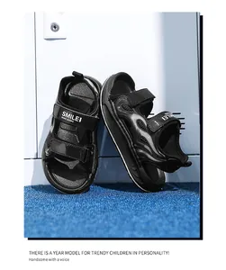 Stylish black kids sports sandals featuring breathable mesh and velcro straps for outdoors.