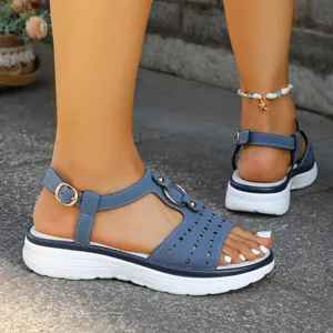 Close-up view of comfortable blue summer platform sandals with T-strap and buckle detail