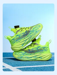 Macro view of lime green boys' sports sneakers featuring a mechanical rotating buckle closure