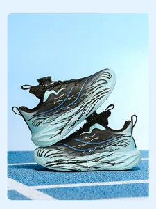 Detailed view of children's sports shoes with rotary buckle and blue flame pattern