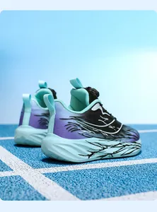 Detail view of children's sports shoes with rotary buckle and gradient purple design