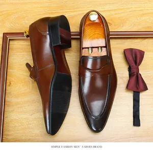 Detailed close-up of premium brown cowhide leather men's loafers in vintage style