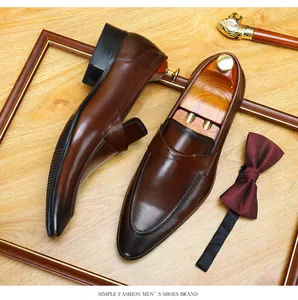 Detailed side and top-down view of men's brown leather loafers in vintage style