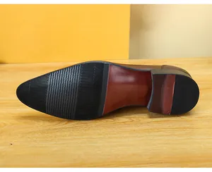 Close-up detail of the anti-slip sole on a classic brown leather men's dress shoe.
