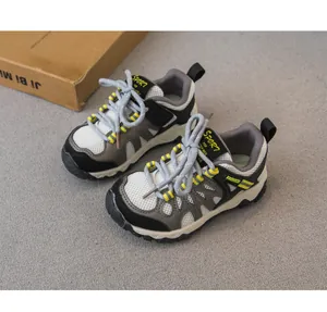 Detailed view of breathable mesh children's hiking shoes in grey and black.
