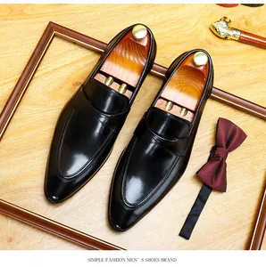 Premium black leather men's dress shoes displayed with a formal bowtie and cane