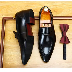 Close-up of men's black leather formal dress shoes with a classic pointed toe design.