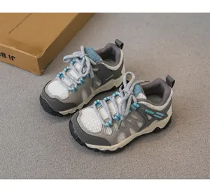 Detailed view of children's grey mesh breathable hiking shoes with anti-slip soles