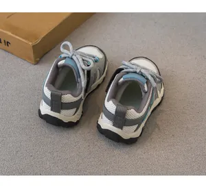 Rear view of breathable mesh kids' hiking shoes with anti-slip soles and grey laces.