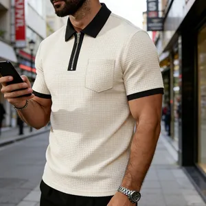 Stylish man wearing a cream textured zipper polo shirt with black contrast collar