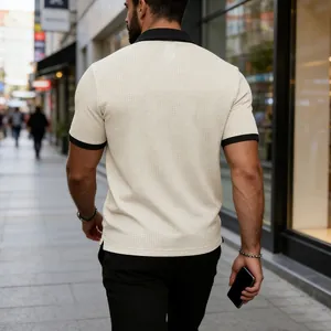 Rear view of men's cream textured polo shirt with black contrast collar and cuffs