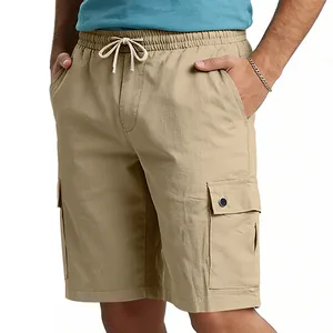 Detailed view of men's khaki cargo shorts featuring elastic waistband and utility pockets