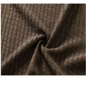 Detailed macro shot of brown textured breathable fabric for men's leisure vacation set