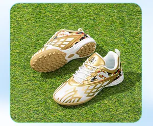 Children's soccer shoes with gold and white pattern for artificial grass training sessions