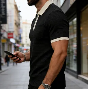 Close-up of waffle-knit zipper Polo shirt with contrast collar and chest pocket.