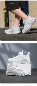 Détail de baskets blanches pour enfants avec boucle rotative et tissu mesh de sport