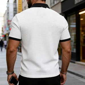 Back view of men's casual white waffle knit polo shirt with black contrast collar