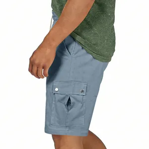 Detail view of men's blue slub cotton linen cargo shorts with side pocket flap.