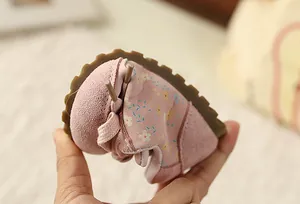 Close-up showing the soft and flexible sole of pink floral toddler sports shoes