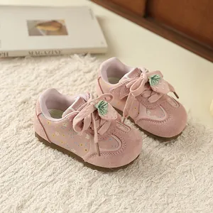 Pink strawberry themed children's athletic sneakers for girls with cute floral patterns