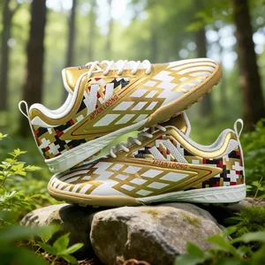 Professional kids golden soccer shoes with TF turf studs in a lush forest setting