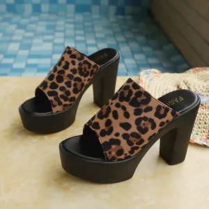 Macro view of leopard print texture on women's platform chunky high heel sandals