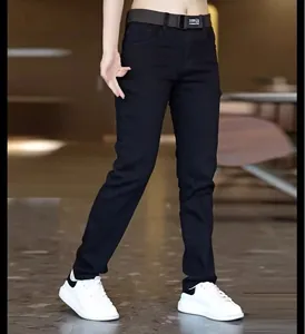 Close-up detail of slim-fit men's black casual jeans styled with a belt and sneakers